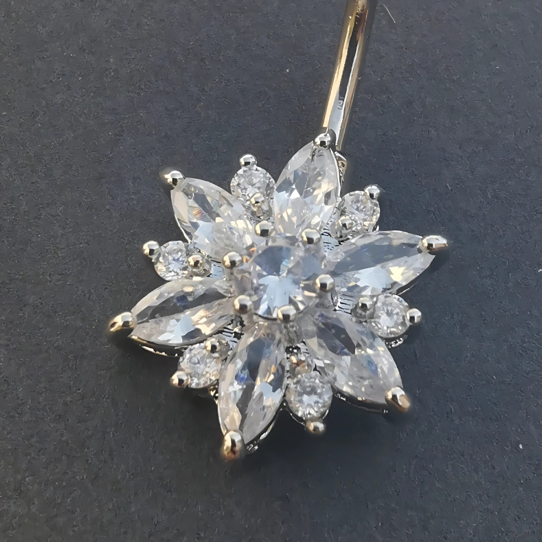 14G curved navel bar in 316L stainless steel topped with a detailed silver flower.