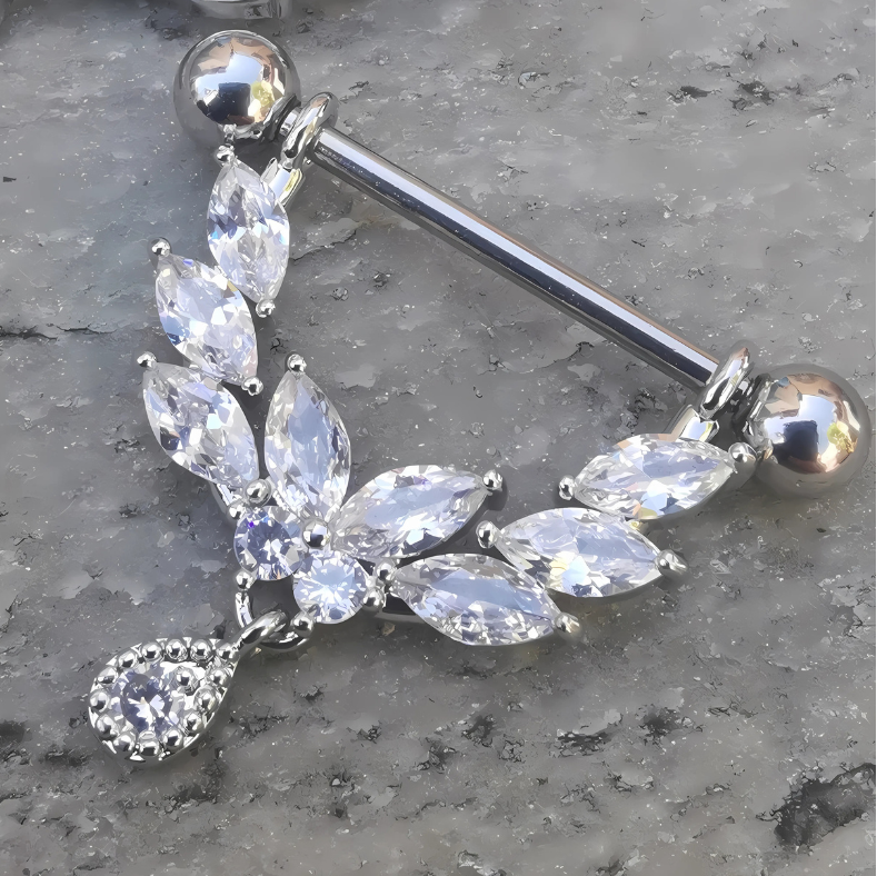 14 gauge 316L surgical steel nipple bar with a shield‑shaped dangle adorned with multiple clear cubic zirconia stones.