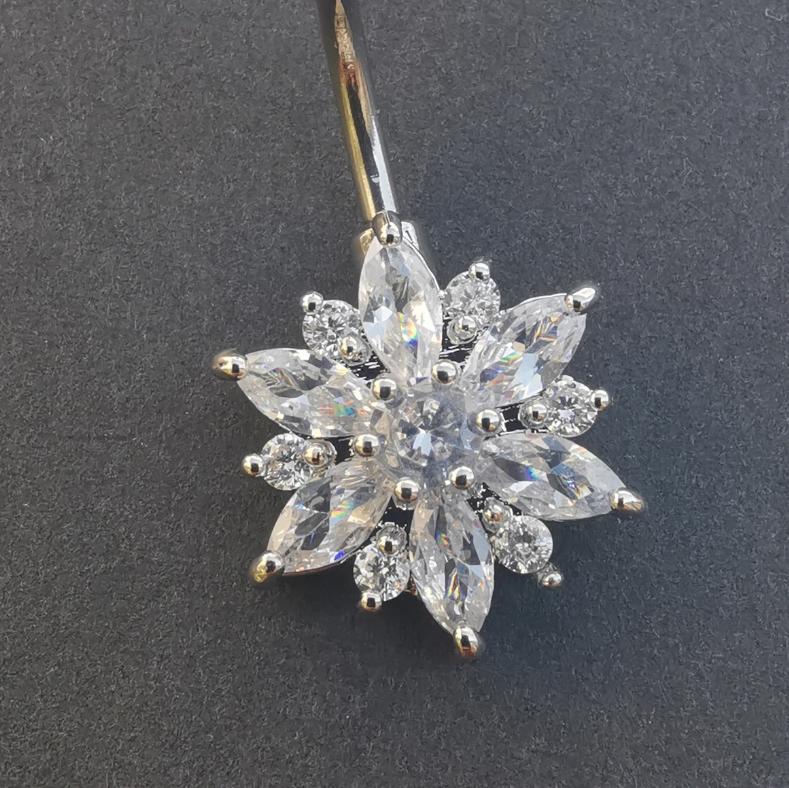 14 gauge 316L surgical steel belly button ring with a polished silver flower charm.