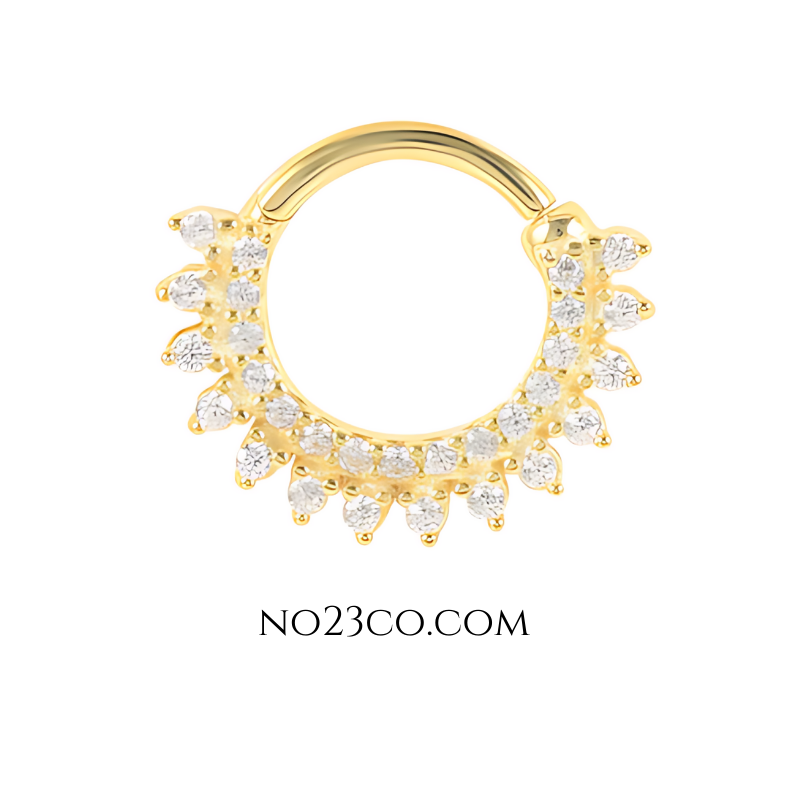 Refined and sparkling gold septum daith ring piercing jewelry with cubic zirconia accents for a luxe finish.
