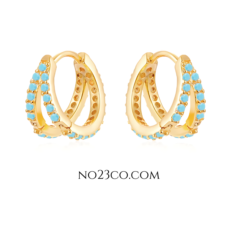 Double turquoise huggie earrings in 18K gold-plated 925 sterling silver, featuring stacked hoops with turquoise enamel for a bold layered look.