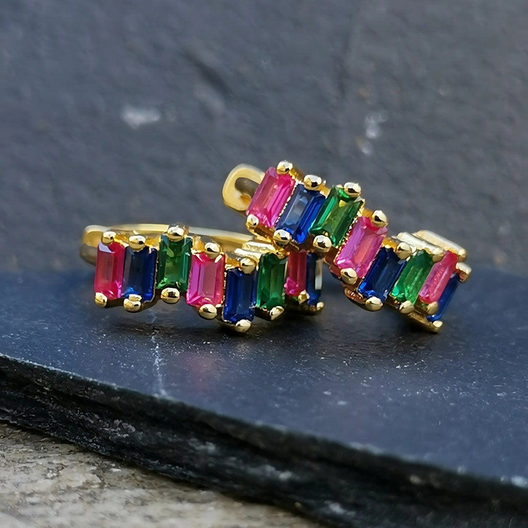 Detailed image of multicolor rainbow 5A cubic zirconia huggies set in 18K gold-plated 925 sterling silver, perfect for bold and playful ear styling.