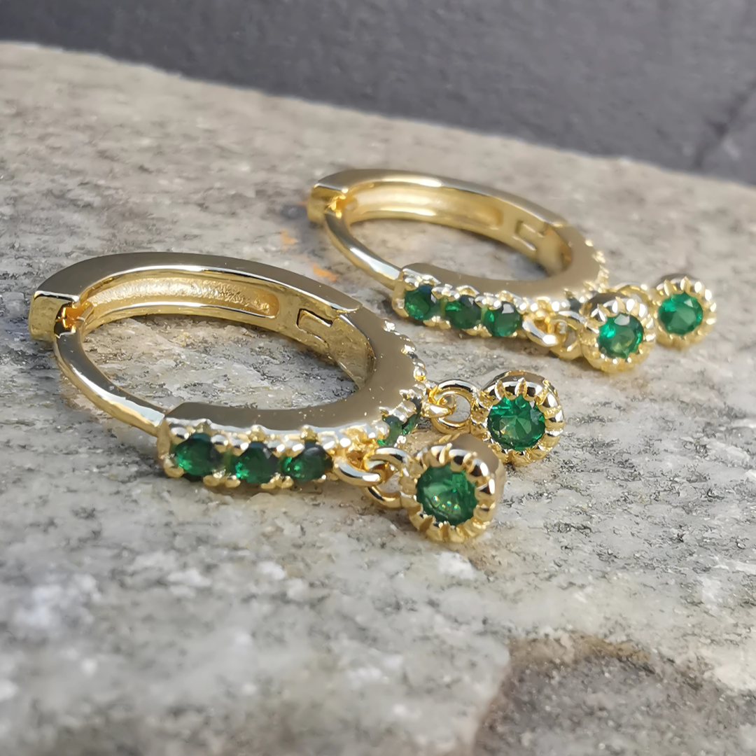 Contemporary hoop ear piercing pair with emerald green sparkle in gold plated 925 sterling silver.