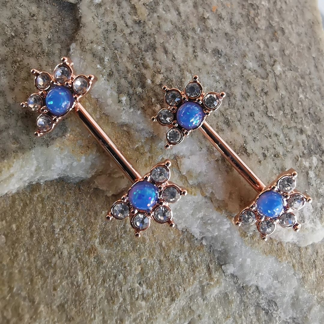 Elegant mandala flower nipple bar jewelry in gold with a blue centerpiece and cubic zirconia, 14G surgical steel 316L