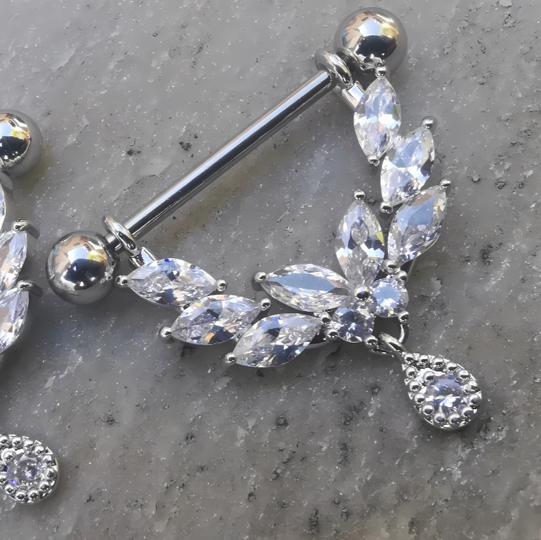 Hypoallergenic 14 gauge 316L surgical steel shield drop nipple ring accented with bright cubic zirconia crystals.