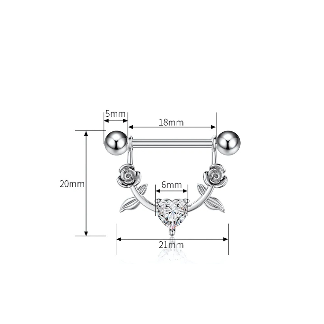 Detailed view of surgical steel nipple shield bar with delicate roses and high-shine cubic zirconia.