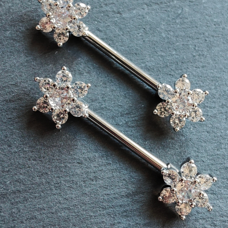 14G silver surgical steel flower nipple bar piercing adorned with cubic zirconia stones