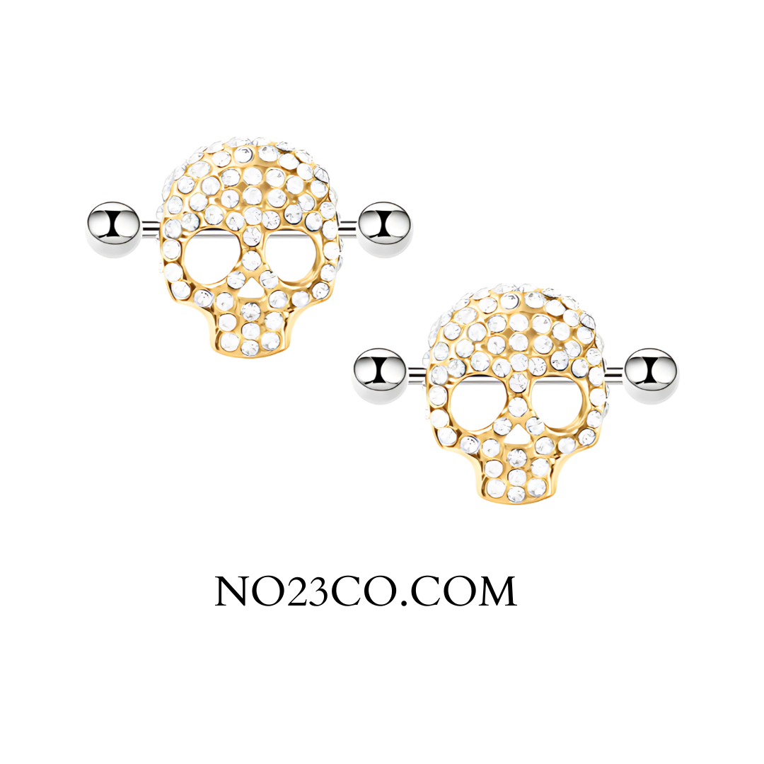 Gold Skull Nipple Barbell Piercing – 14G Surgical Steel with White Zirconia Sparkle – A bold and edgy design featuring gold-tone skulls and shimmering gemstones for a striking look.