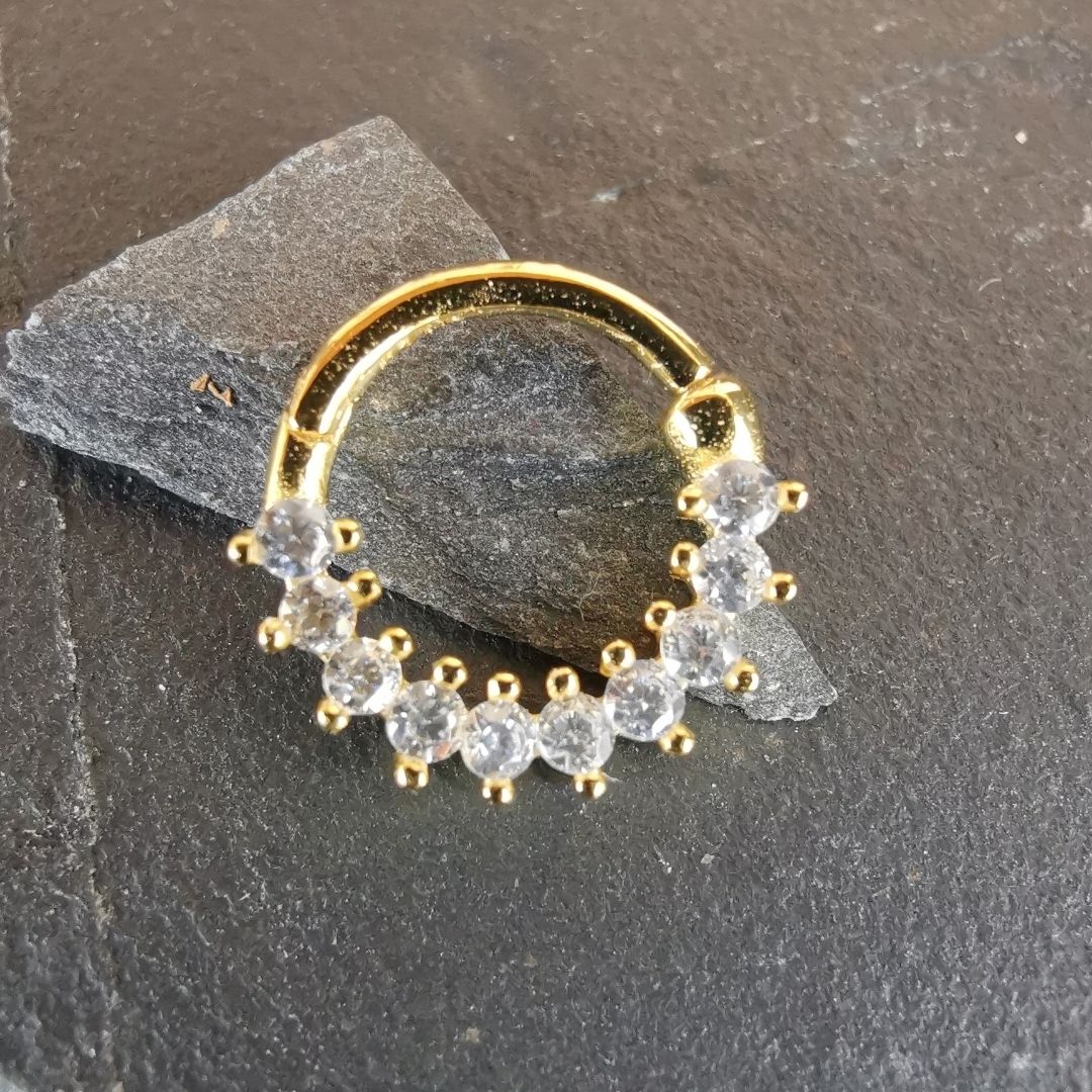 Modern minimalist gold piercing ring for septum or daith, made of 18K gold plated 925 silver.