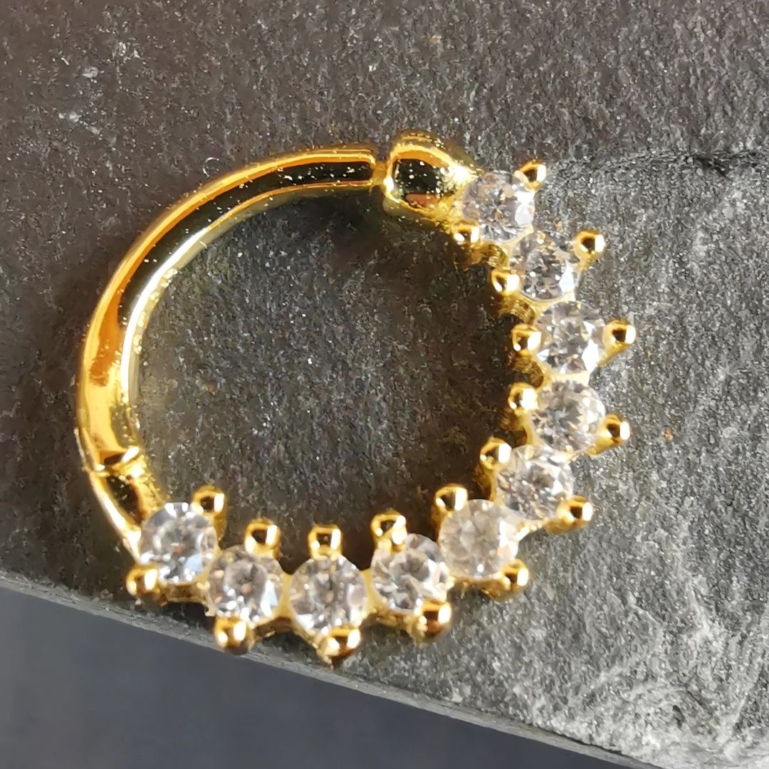 Lightweight and stylish 18K gold plated tiny septum daith ring, crafted from durable sterling silver.