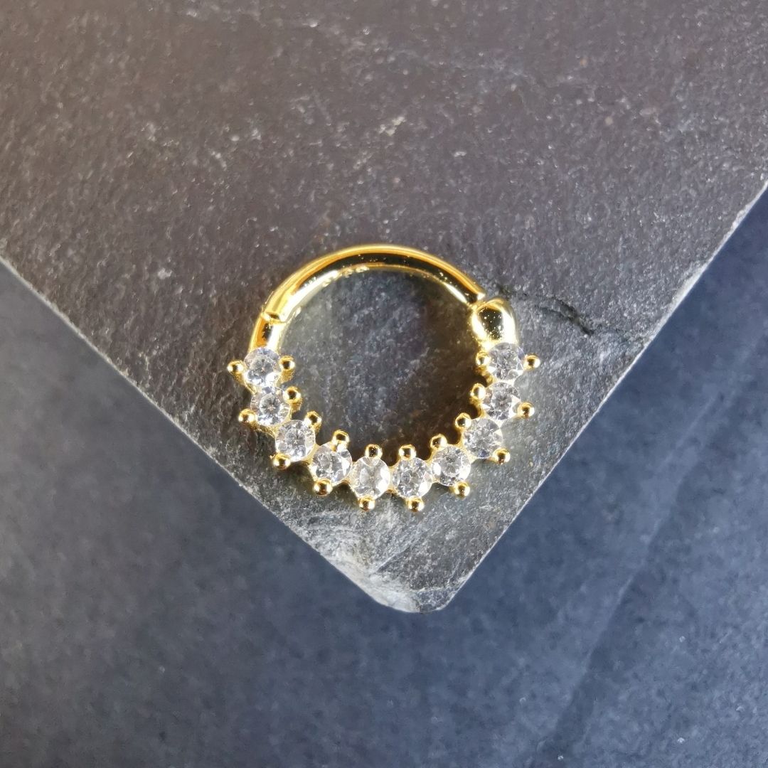 Tiny 18G gold septum daith ring piercing jewelry crafted from 18K gold plated 925 sterling silver.