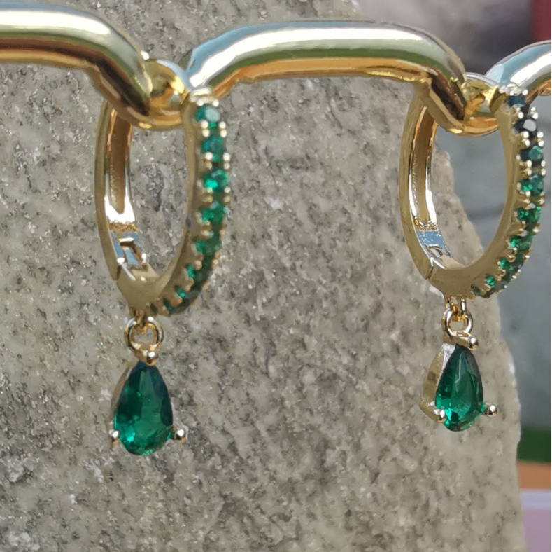 Stylish ear jewelry set featuring striking green zirconia droplets on premium 18K gold plated sterling silver.