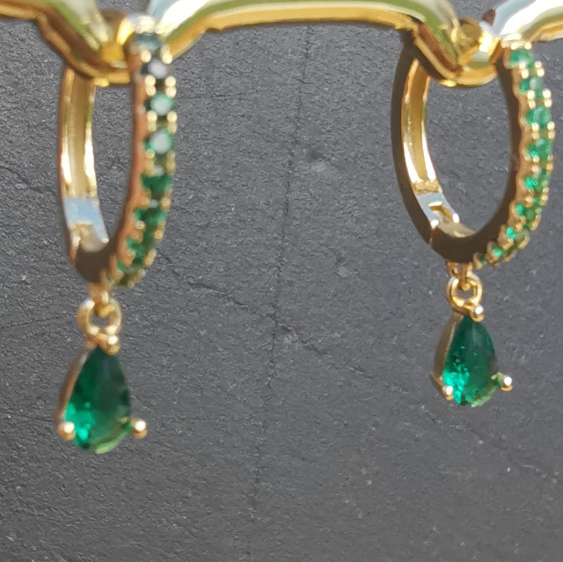 Luxurious green zirconia ear piercing pair showcasing a bold design in 18K gold plated 925 sterling silver.
