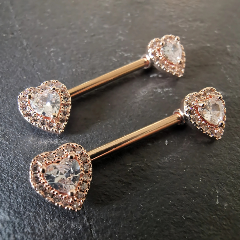 Heart nipple bar jewelry in rose gold with cubic zirconia, crafted from durable 14G surgical steel 316L.