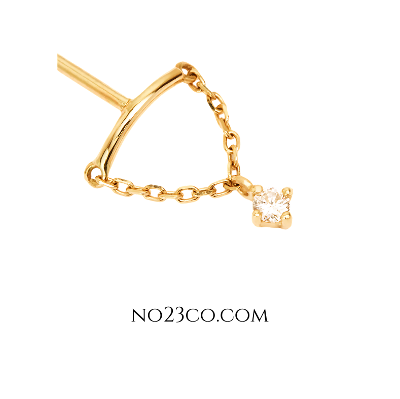 Side view of minimalist chain-connected gold stud earring in 18K gold-plated sterling silver, ideal for double lobe piercings.