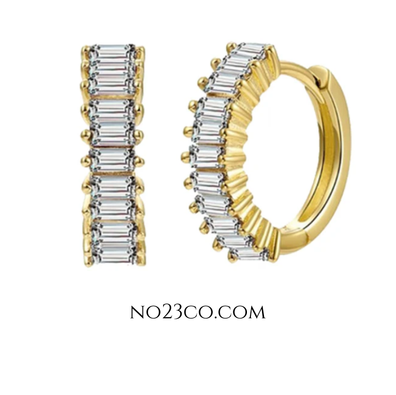 White zirconia huggie earrings crafted in 18K gold-plated 925 sterling silver, featuring rectangular-cut clear stones and a minimalist hoop design.