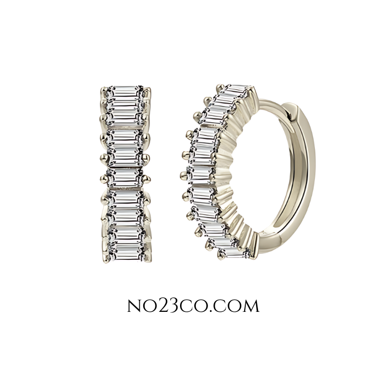 White zirconia huggie earrings crafted in 925 sterling silver, featuring rectangular-cut clear stones and a minimalist hoop design.