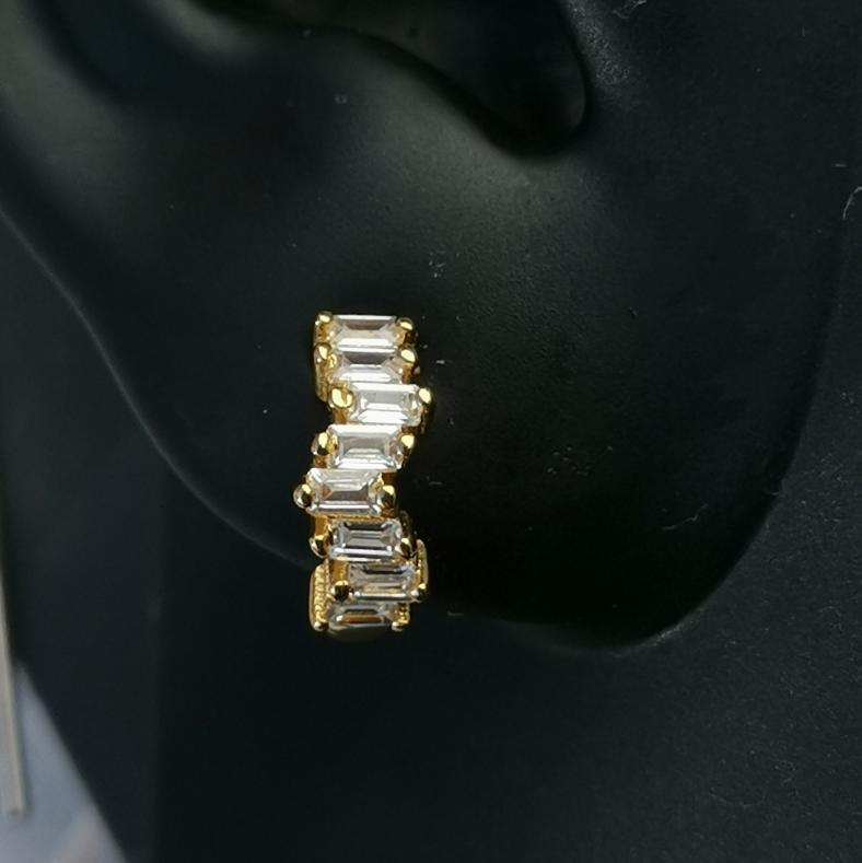 Minimalist huggie earrings with rectangular white cubic zirconia set in 18K gold-plated 925 sterling silver, perfect for stacking or wearing solo.