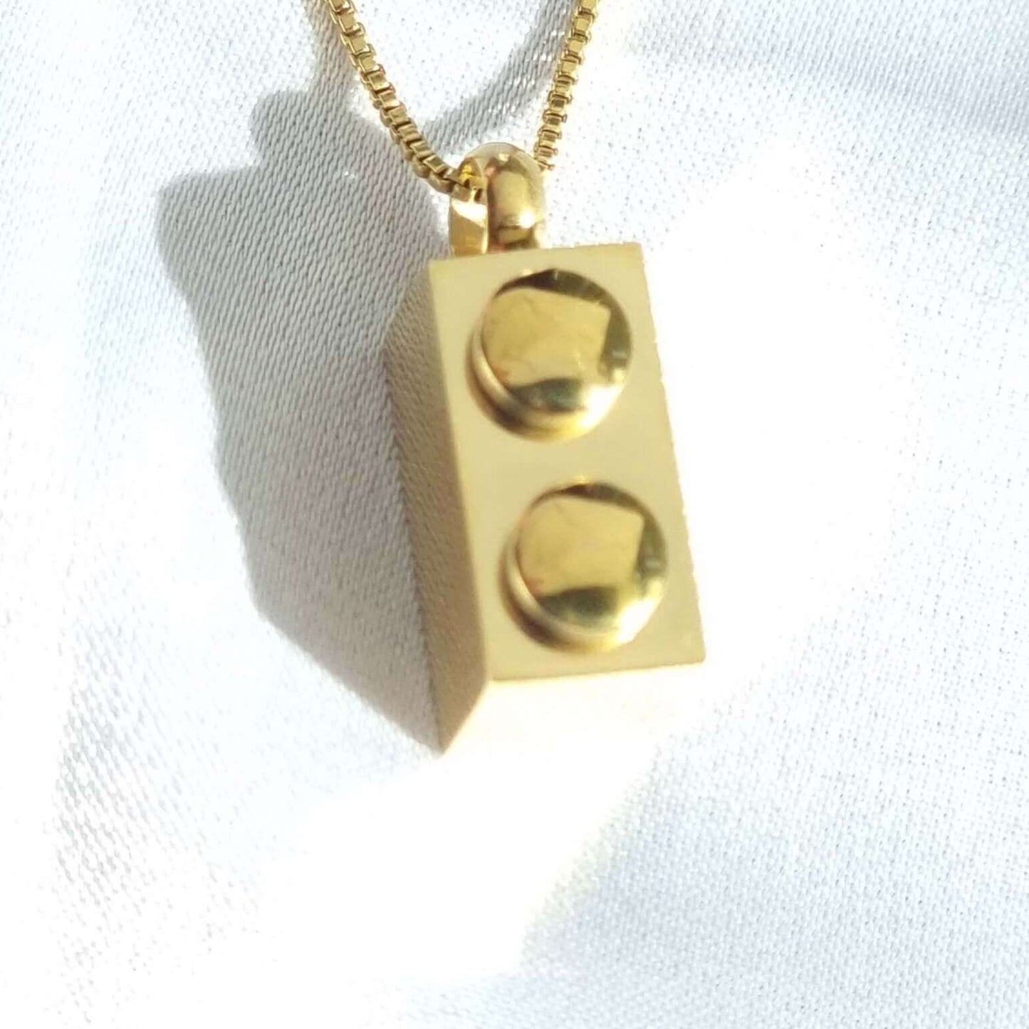 Stylish rectangle brick necklace with a Lego-inspired design, made with waterproof 18K gold PVD plated stainless steel.