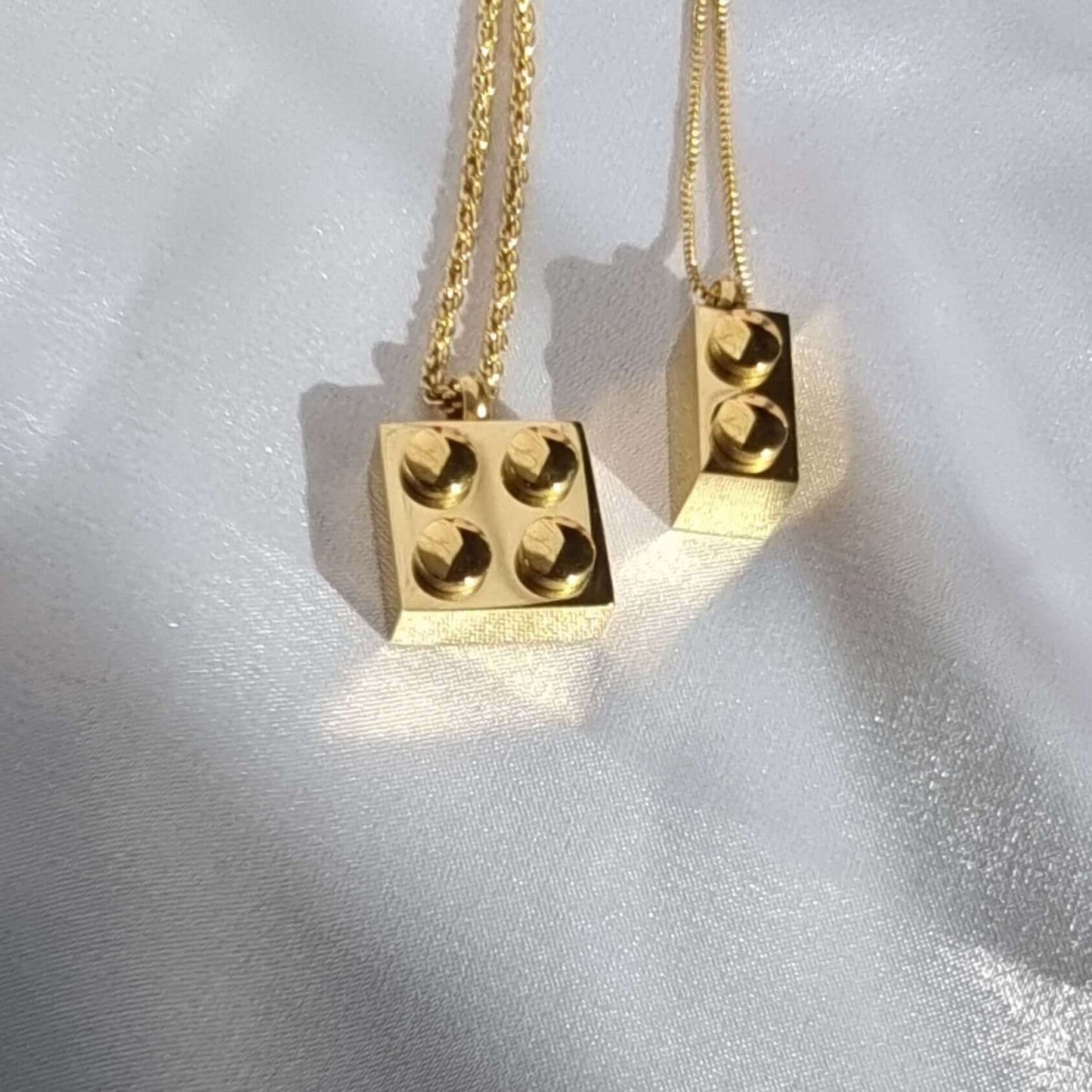 18K gold PVD plated stainless steel necklace featuring a Lego-style square and rectangle brick design, waterproof and sweatproof