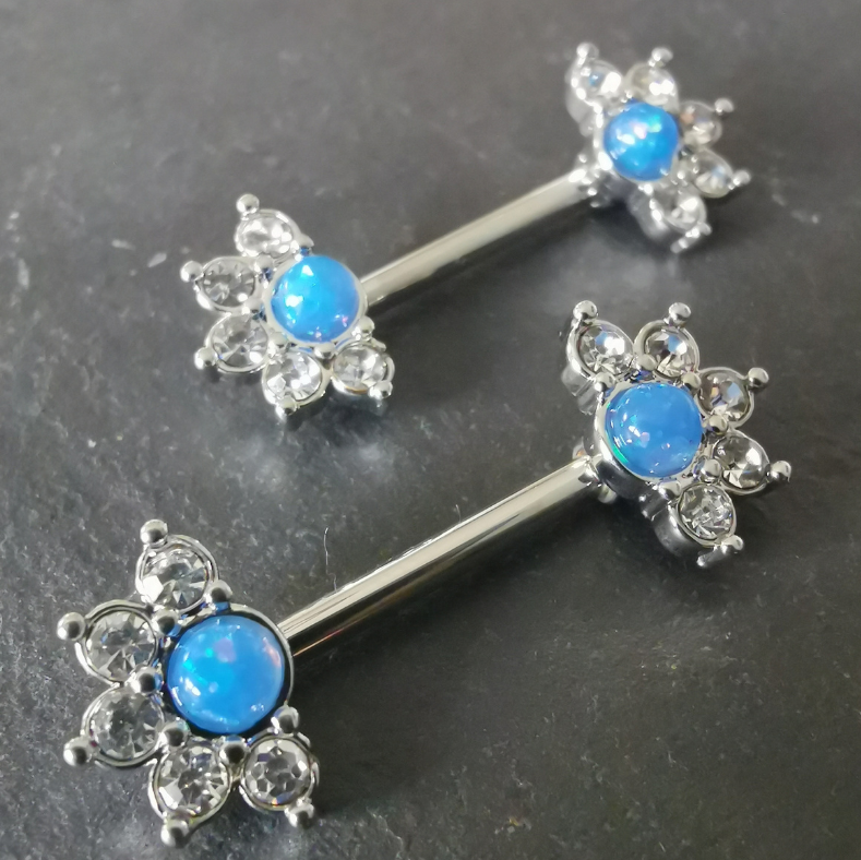 Mandala flower nipple bar piercing with blue stone and cubic zirconia, made from 14G silver surgical steel 316L