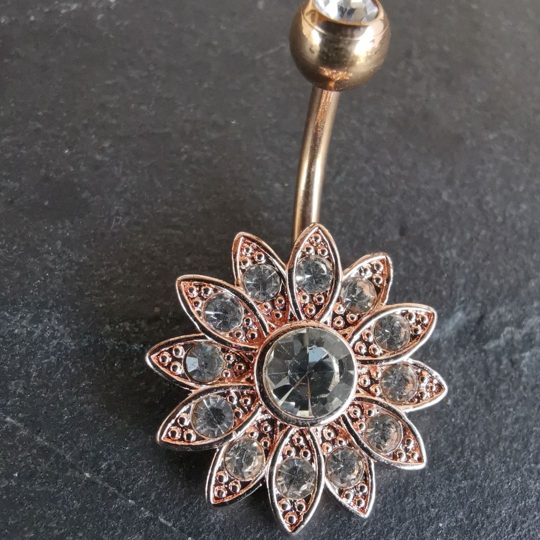 Rose gold belly button piercing jewelry featuring an intricate mandala design, made with high-quality 14G surgical steel 316L