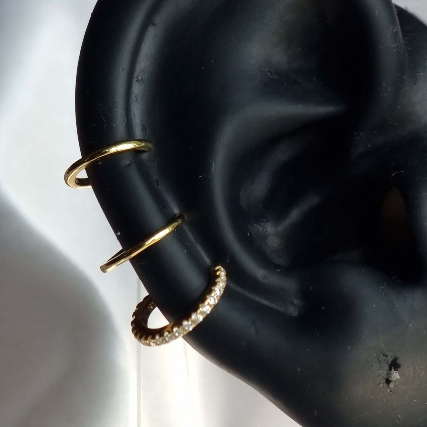 No piercing ear curation earring with 3 hoops.