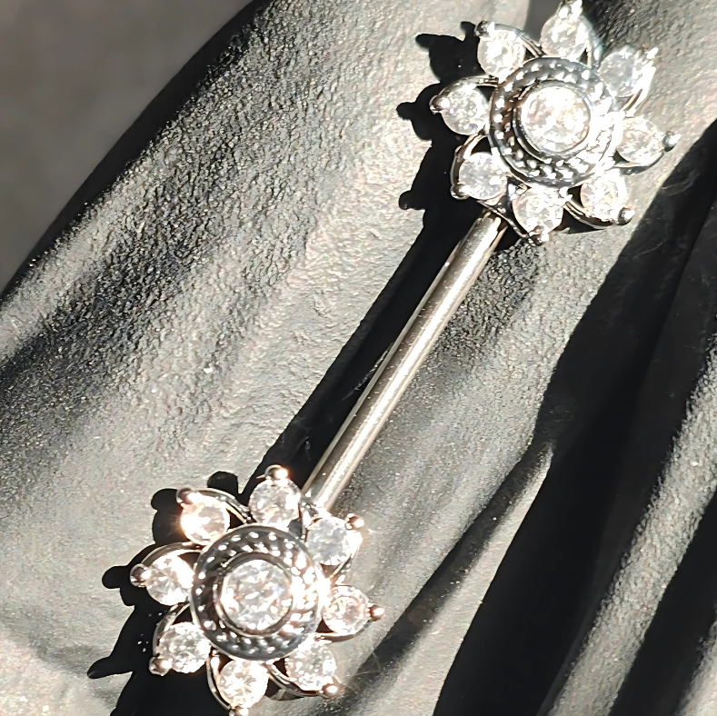 Intricately designed mandala nipple bar in hypoallergenic surgical steel, adorned with dazzling cubic zirconia.