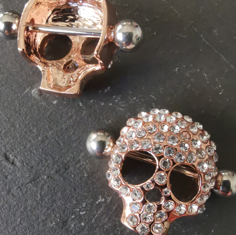 Edgy Rose Gold Skull Nipple Shields – 14G 316L Surgical Steel with Sparkling White Zirconia – Durable and chic, perfect for a statement look.