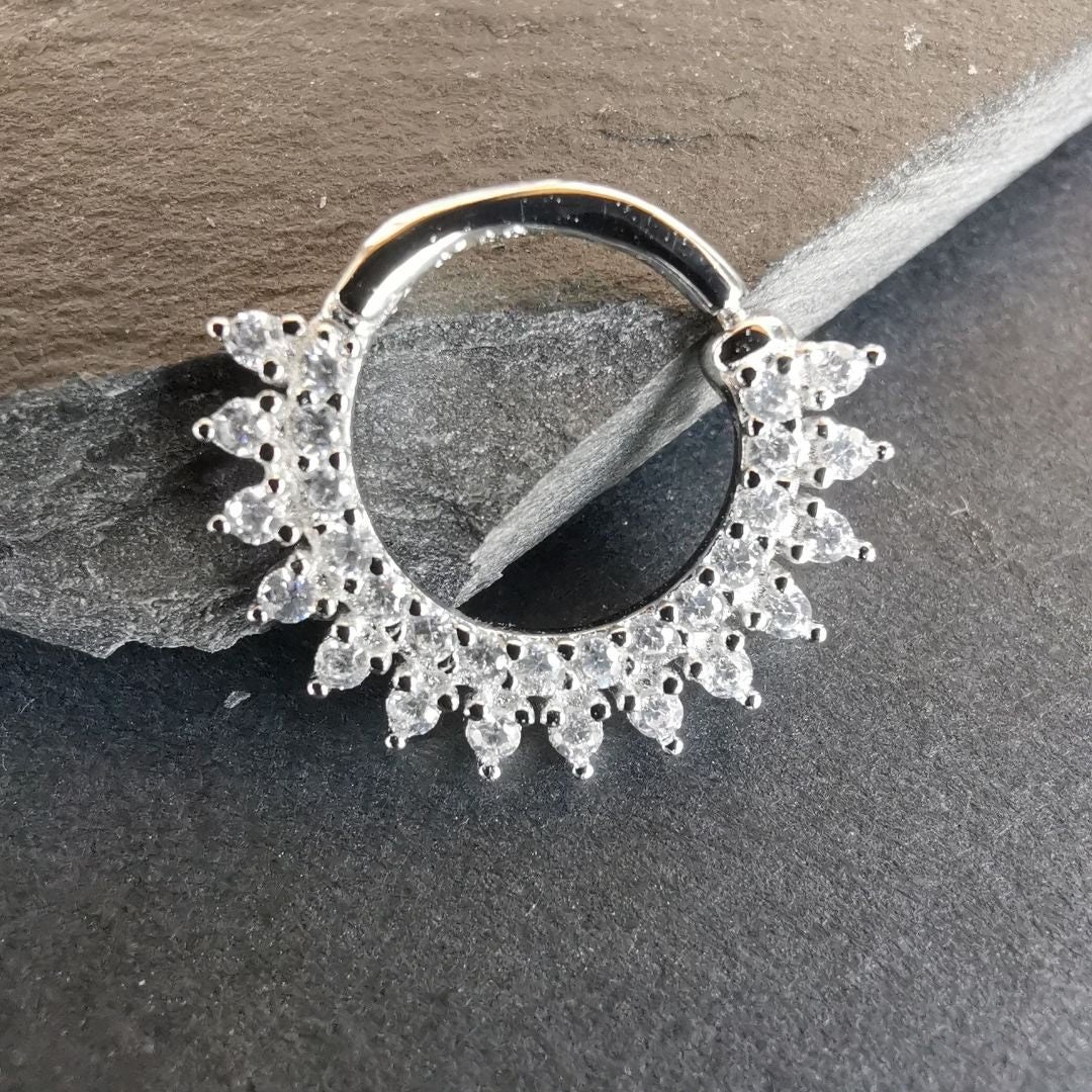 Modern 18G septum piercing jewelry featuring a classic ring design in sterling silver.