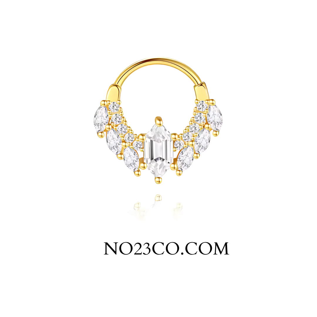 Close‑up of 18 G 925 sterling silver septum & daith ring, 18 K gold‑plated, featuring a single prong‑set cubic zirconia gem