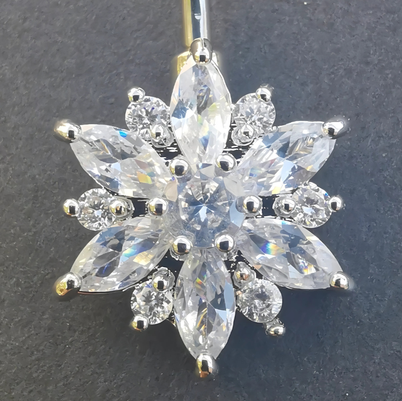 Hypoallergenic silver flower-adorned belly ring in 14 gauge surgical steel.