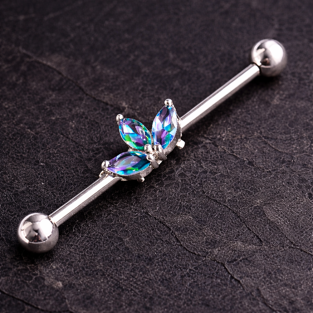 Industrial earring with colorful gemstones on a dark textured background