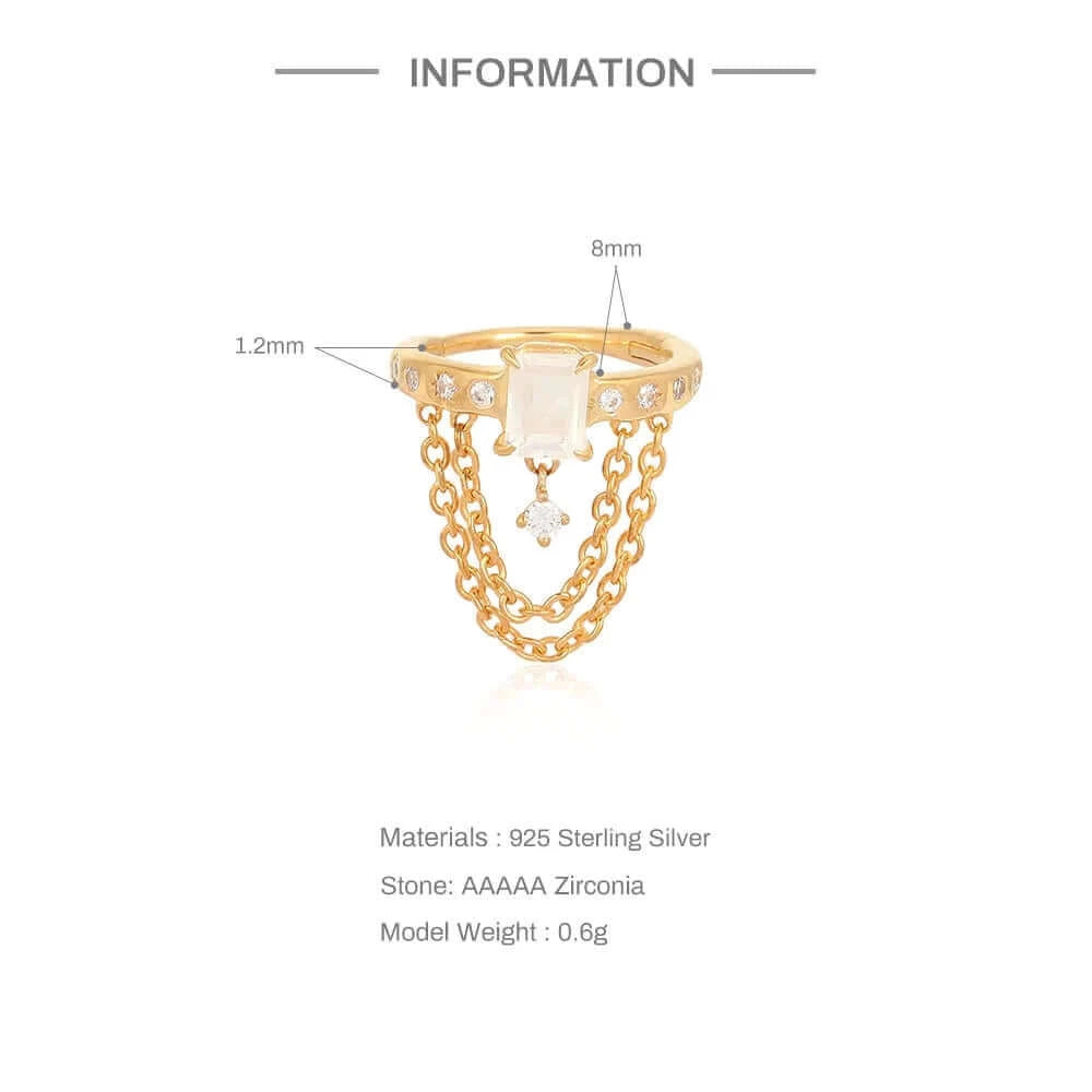 Detailed image of helix hook ear piercing displaying the contrast between luxurious gold and sleek sterling silver with zirconia highlights.