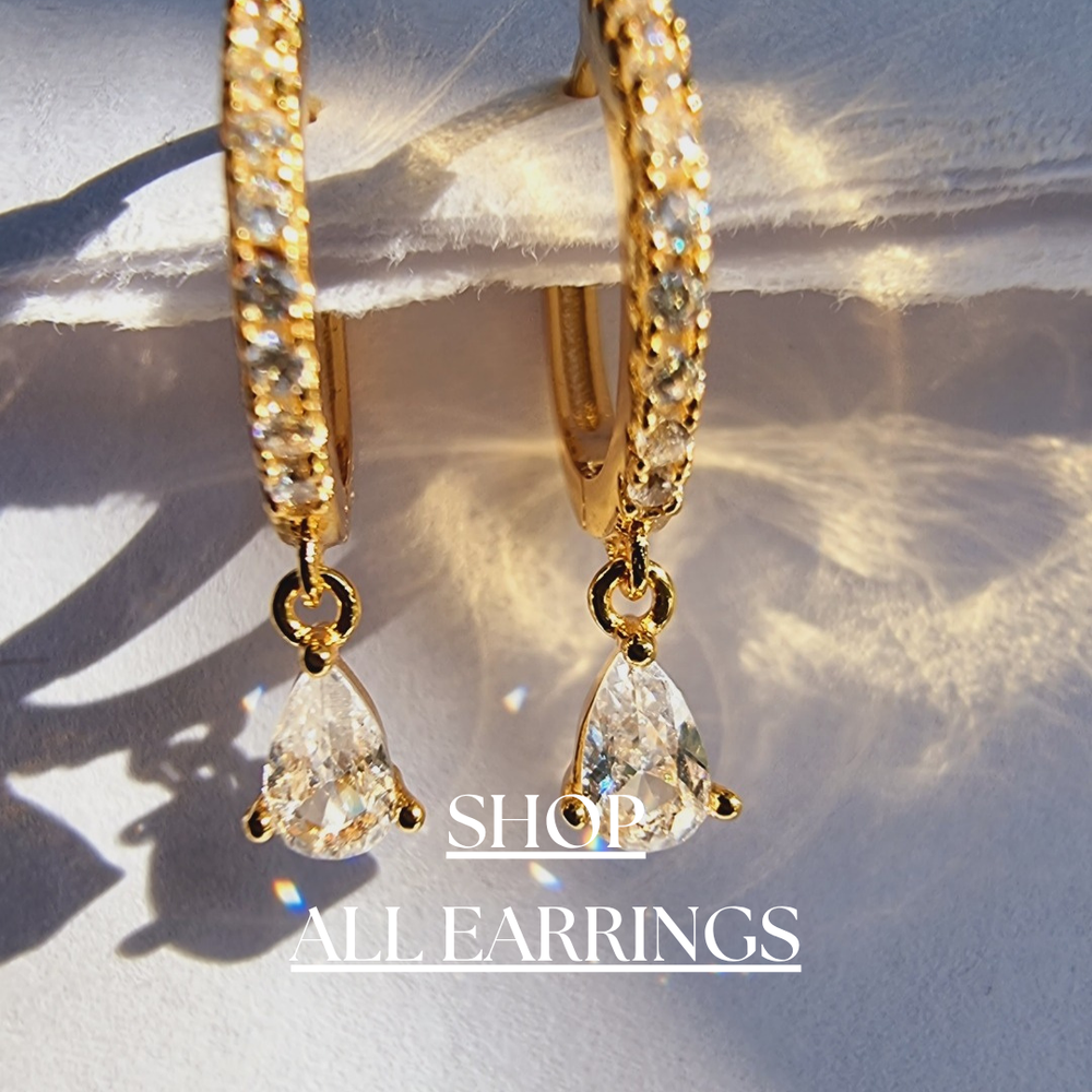 Explore our stunning Earring Collection, featuring a variety of designs from classic studs to elegant hoops, statement pieces, and more. Crafted with quality materials, our earrings offer a stylish touch for any occasion.