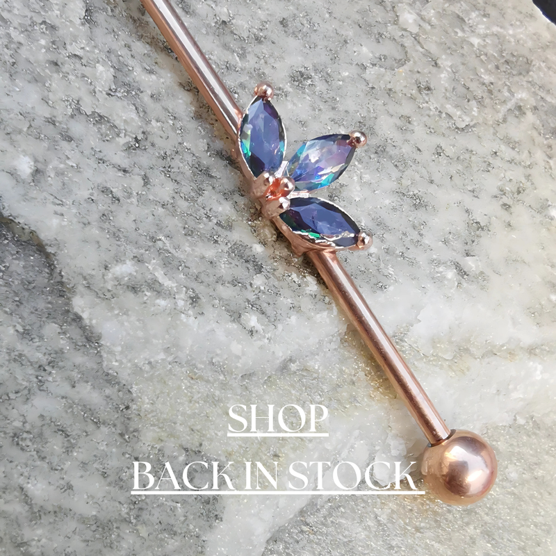 A trendy collection of industrial piercing jewelry, featuring sleek barbells in gold, silver, and rose gold finishes!