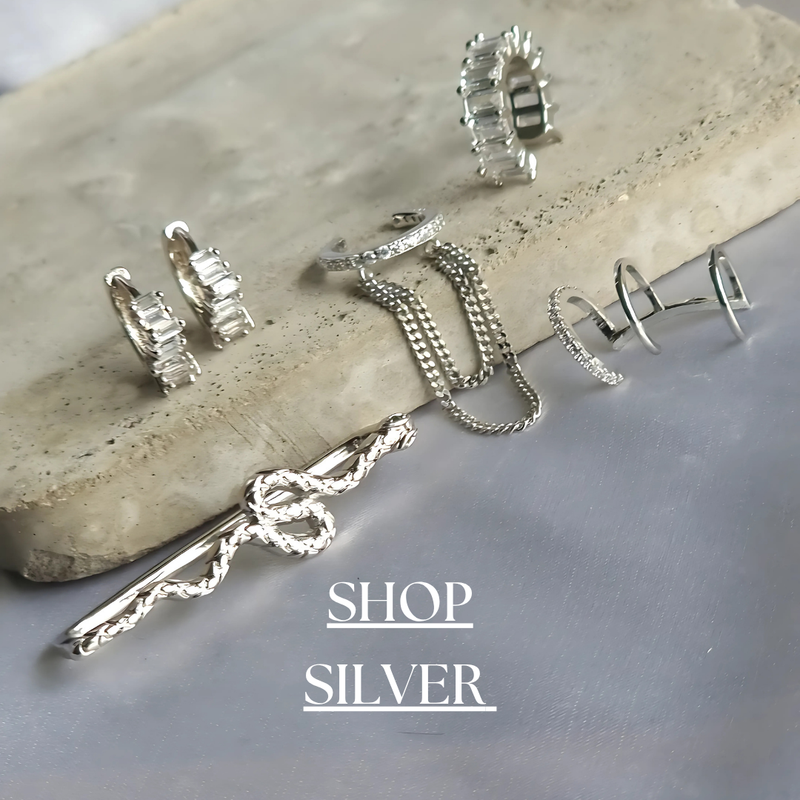 Explore our Silver Jewelry Collection, featuring timeless designs crafted from high-quality 925 sterling silver, stainless steel, 316L surgical steel, and titanium. Perfect for any occasion, these durable pieces blend elegance with modern edge.