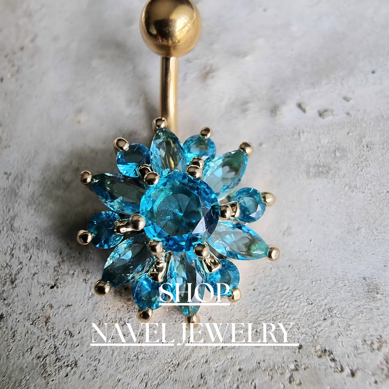 A stylish collection of navel rings featuring gold, silver, and rose gold designs with cubic zirconia, charms, and intricate details. Perfect for belly button piercings, crafted from high-quality surgical steel for durability and comfort.