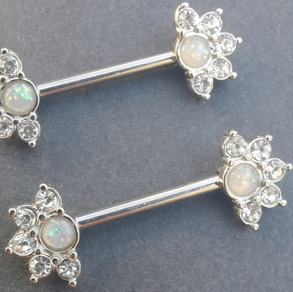 Silver 14 gauge nipple ring with mandala flower design and milky opal accent, crafted from surgical steel.