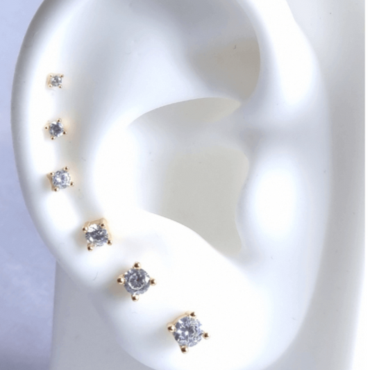 6 white stone stud earrings set from large to small on ear