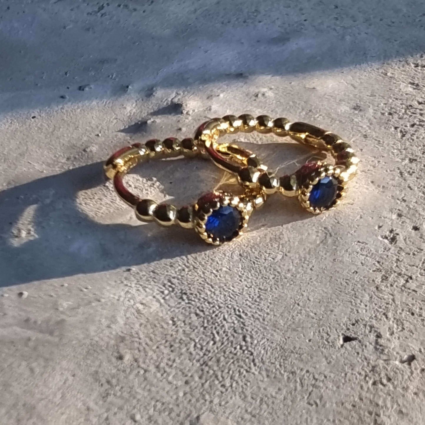 8mm  Gold hoop earring with blue stone