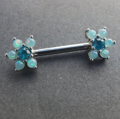 Elegant blue pearl flower nipple bar in 14G silver surgical steel 316L, accented with sparkling cubic zirconia.