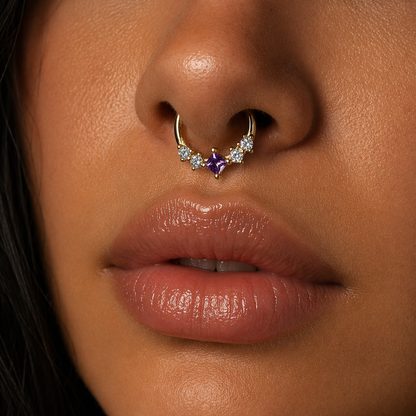 Close-up of a person wearing a nose ring with gemstones.