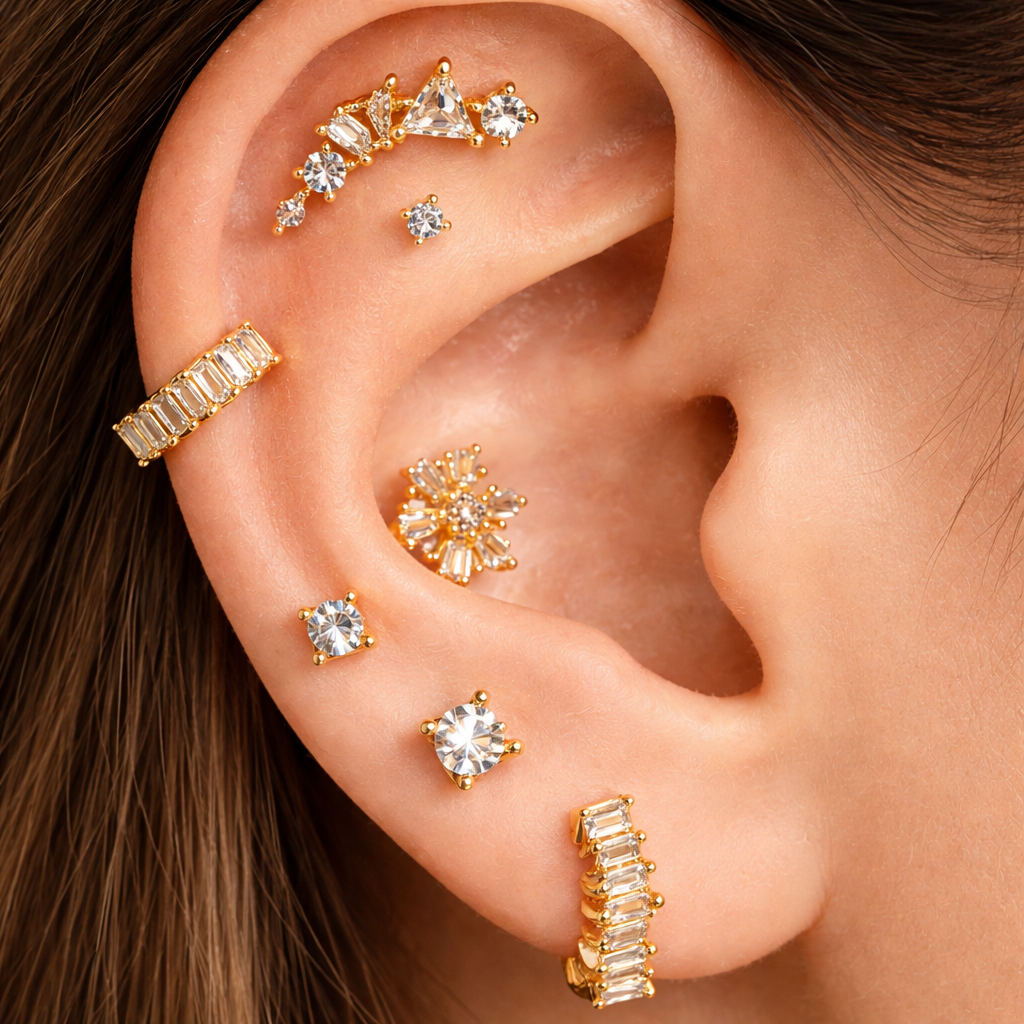 Close-up of an ear with gold and diamond earrings