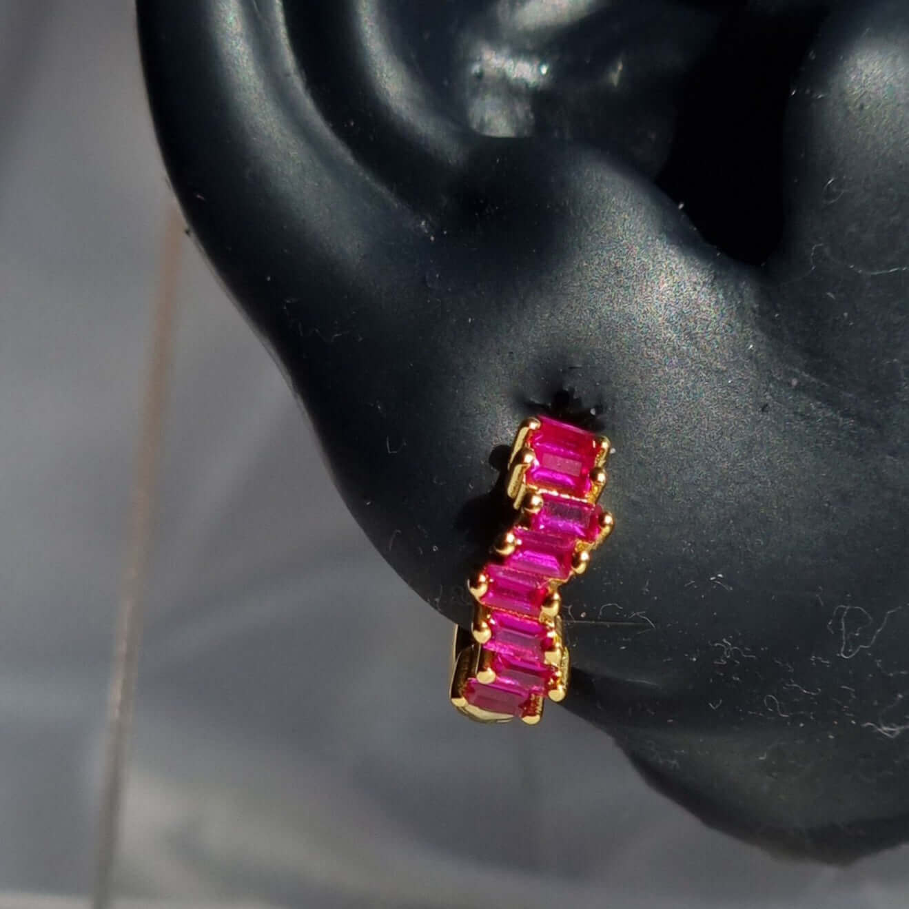 Gold and Magenta Hoop Earrings on ear