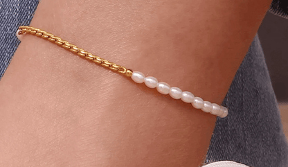 Gold anklet with pearls on feet