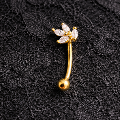 Gold eyebrow/rook bar with floral design on a black lace background