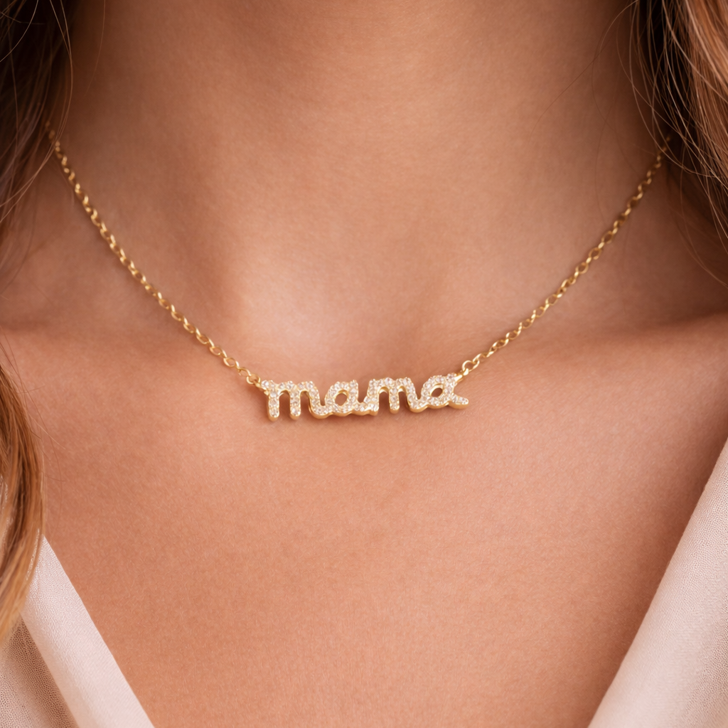 Gold 'mama' necklace on a person's neck