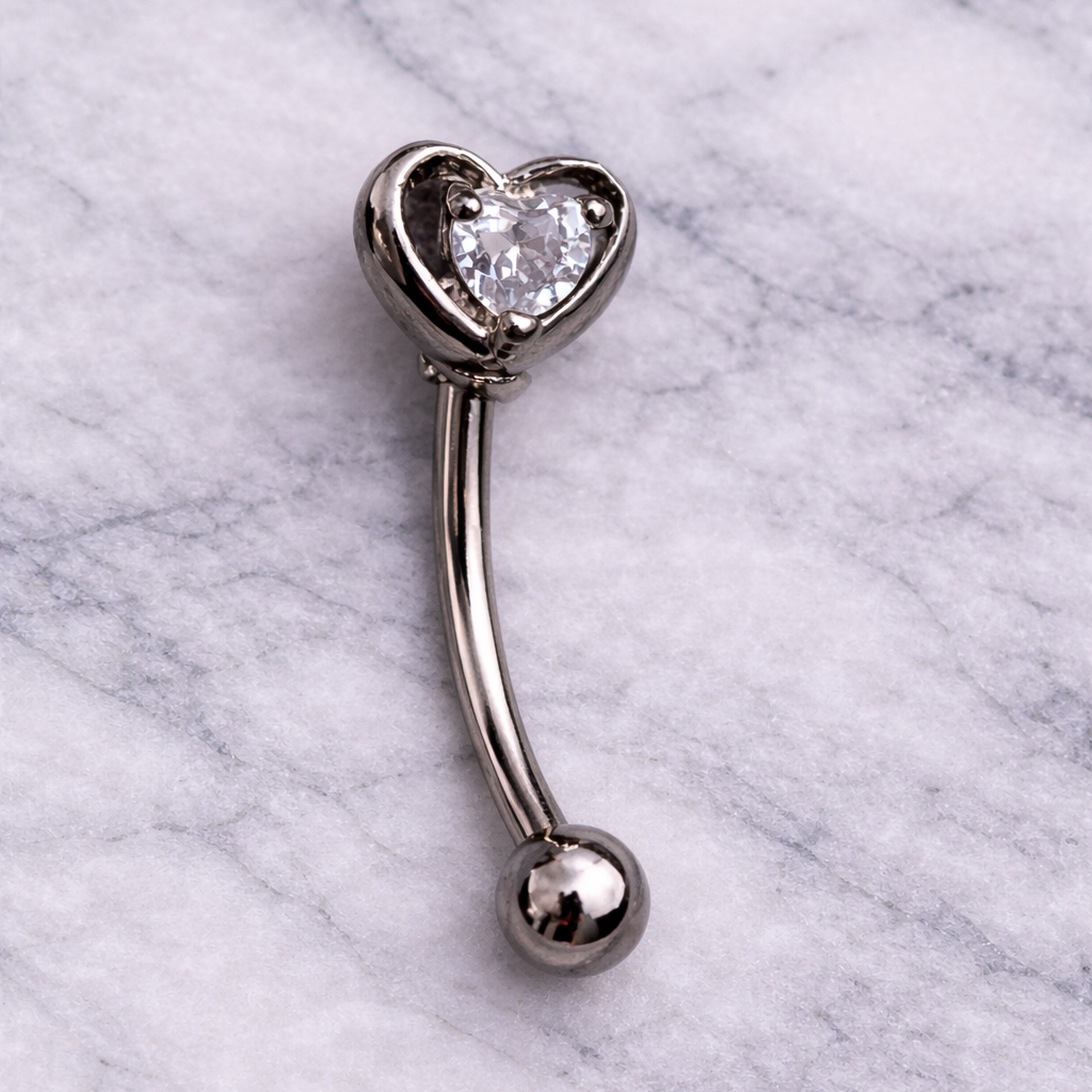 Heart-shaped eyebrow/rook bar on a marble background