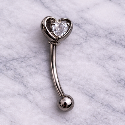Heart-shaped eyebrow/rook bar on a marble background